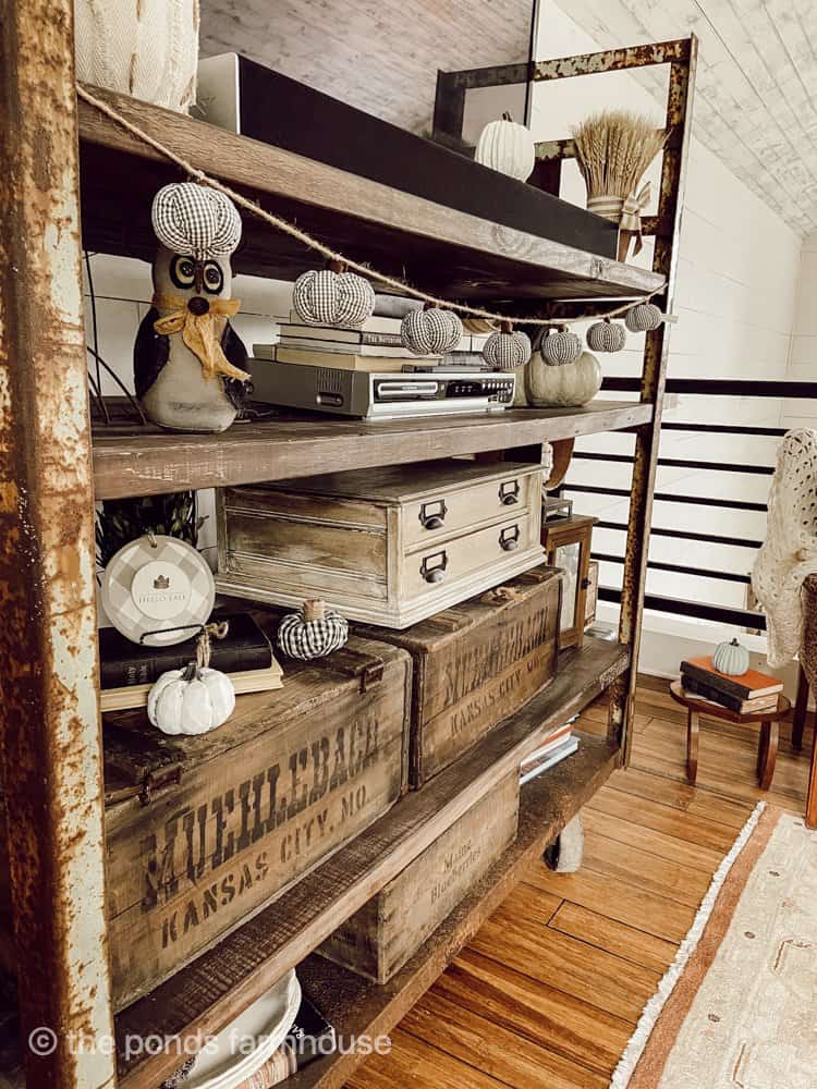 Industrial Farmhouse Fall Decor with pumpkins on the commercial cart. 