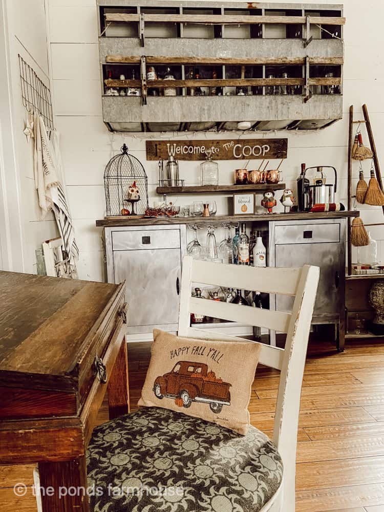 Industrial Farmhouse loft bar made from vintage hospital carts and old nesting box.  With old desk and chair