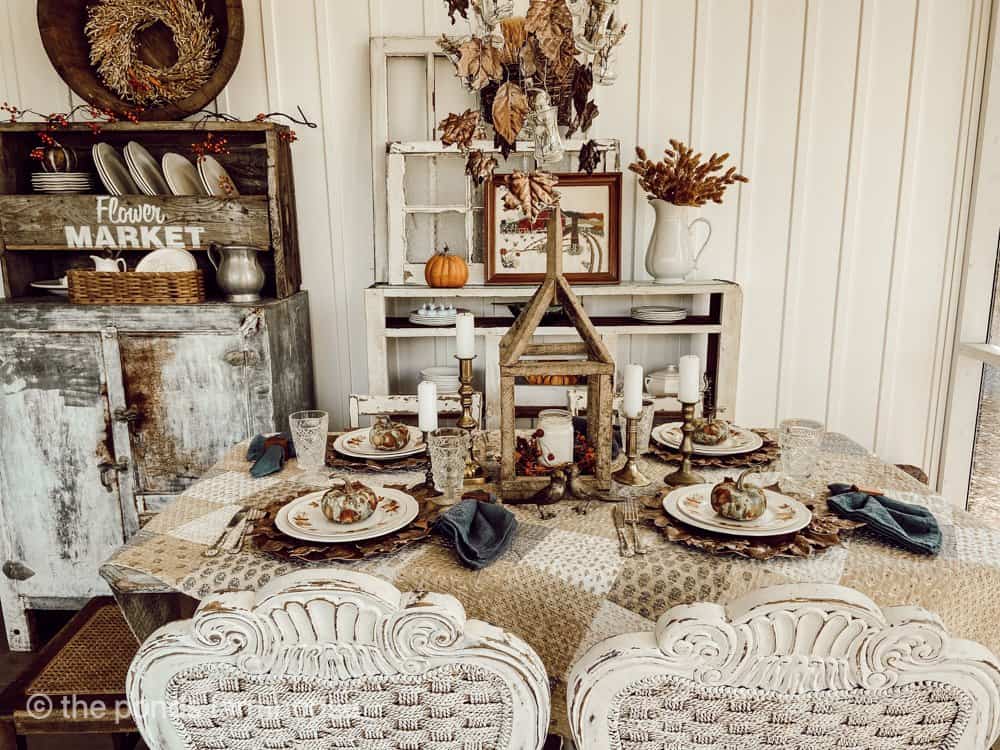 Screened Porch Fall Tablescape with decoupage pumpkins and plaster leaf plate chargers.  