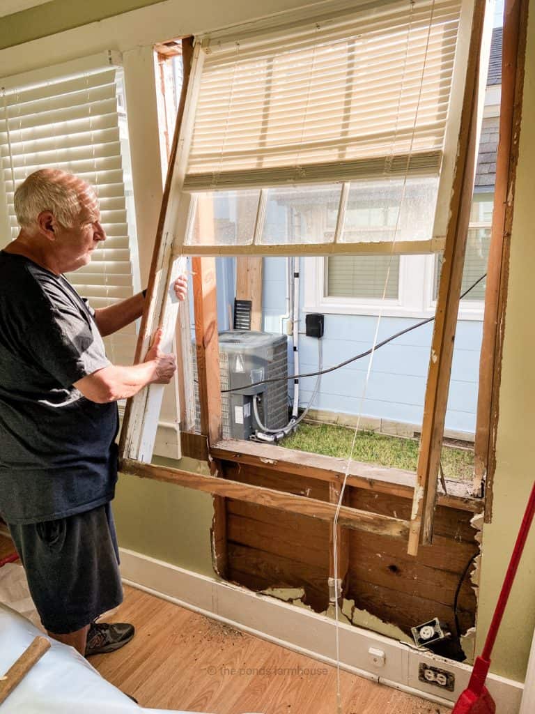 Removing old window to make room for a closet in the tiny house remodel.  