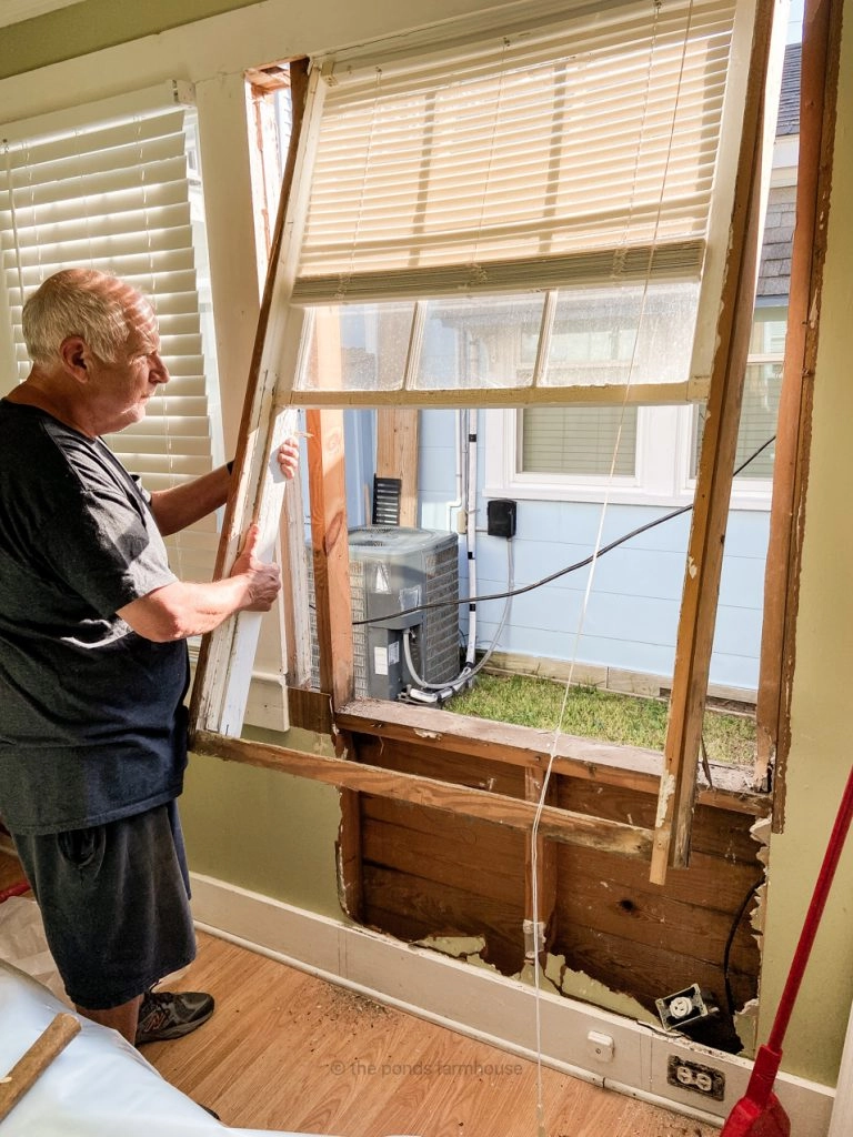 Removing old window to make room for a closet in the tiny house remodel.  