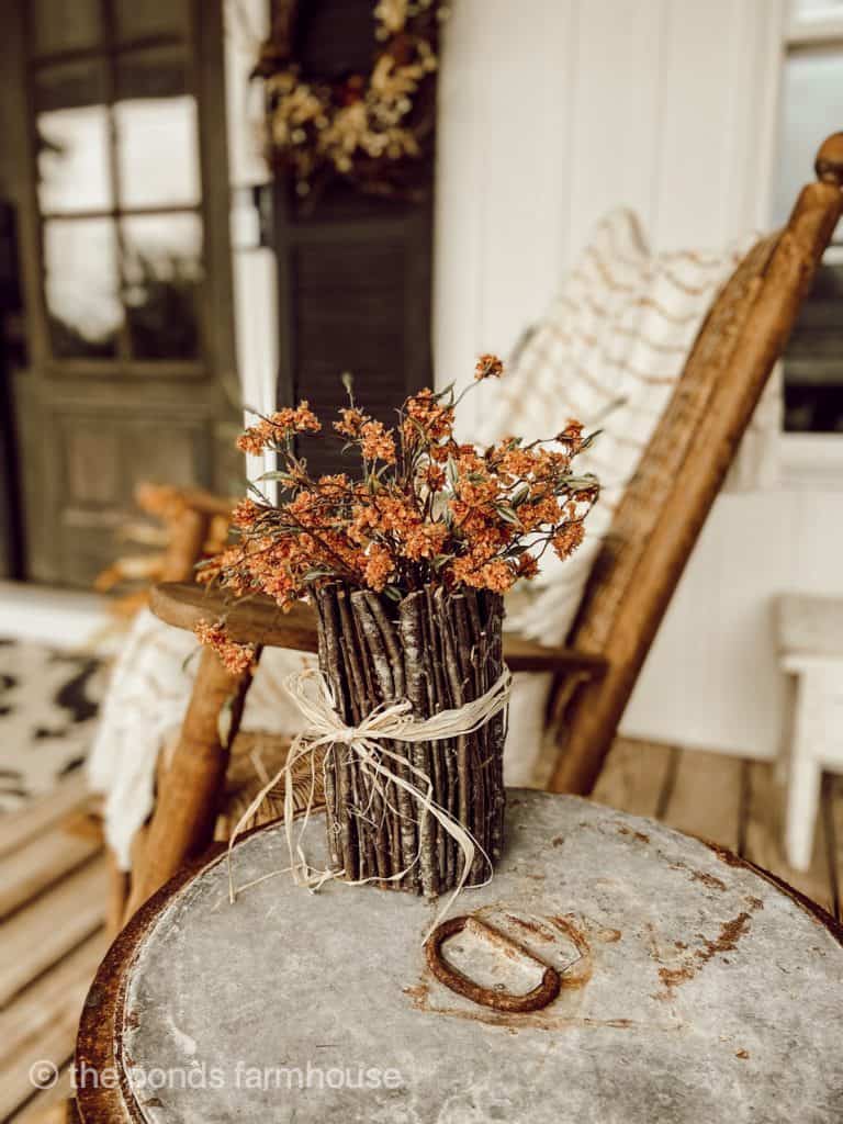 Upcycled Tin Can Covered with Twigs for great fall decor.  Just add fall floral stems. 