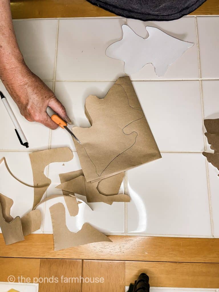 Cut leaves from kraft paper with sharp scissors