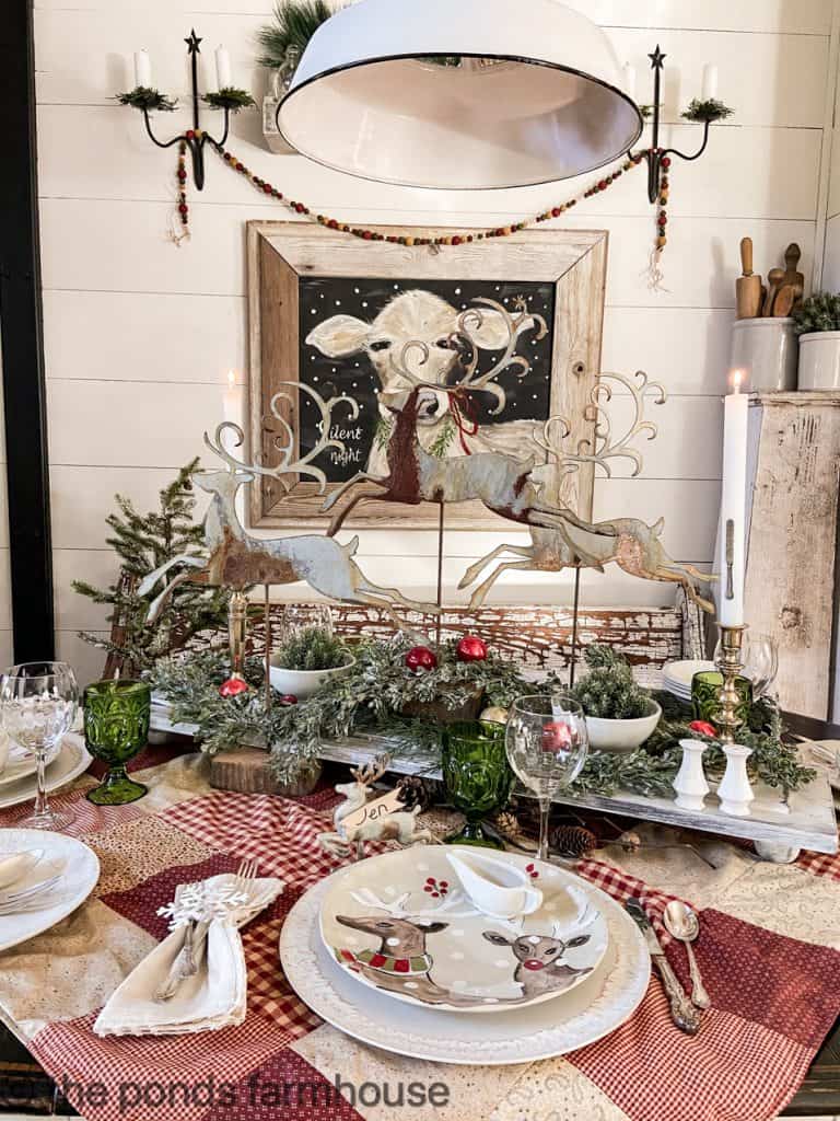 Reindeer Inspired Creative Christmas Table with wooden riser and metal reindeer.
