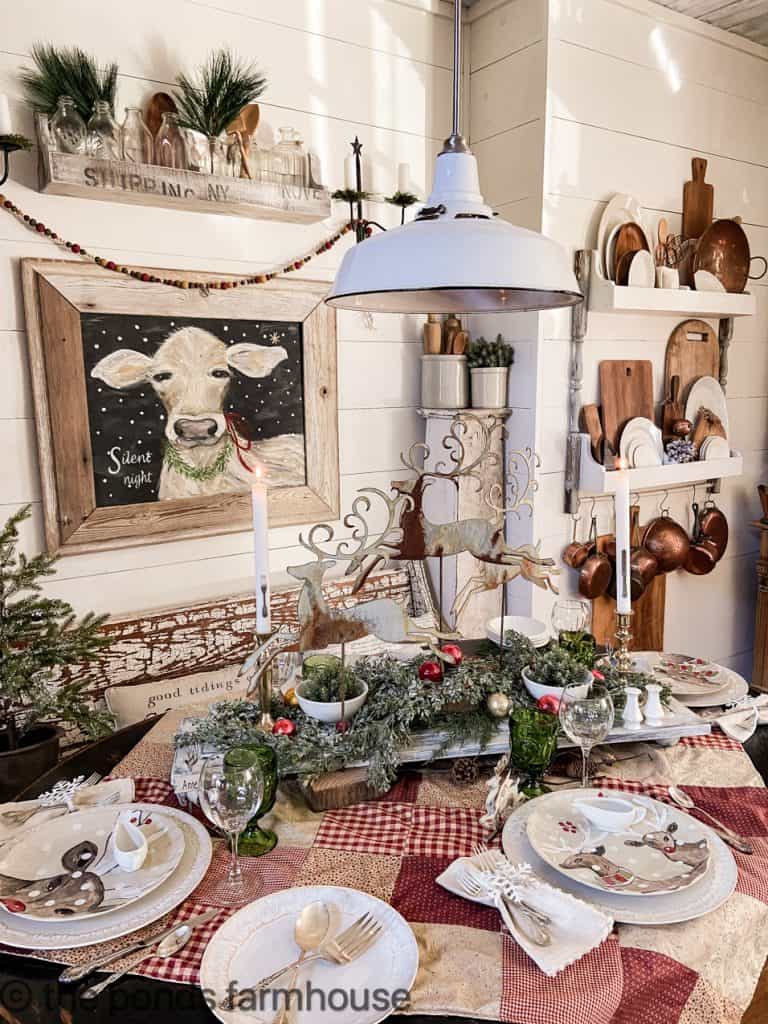 Christmas Table Decor with Reindeers and patchwork tablecloth