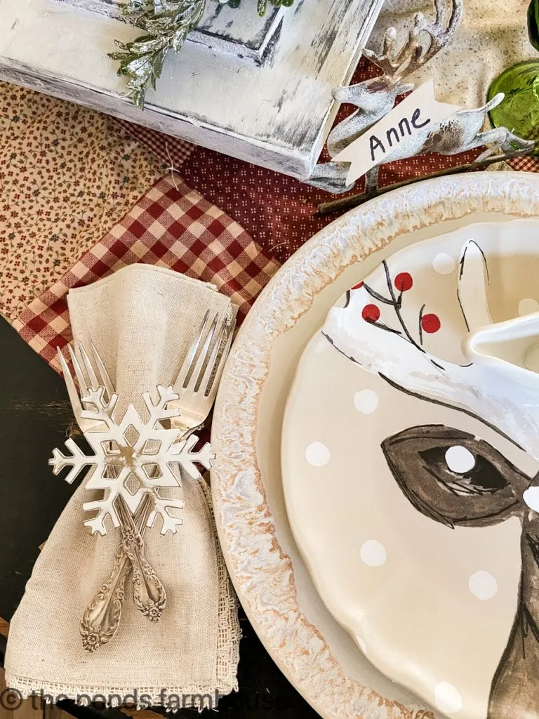 Vintage Cutlery with snowflake napkin ring and deer plates.  