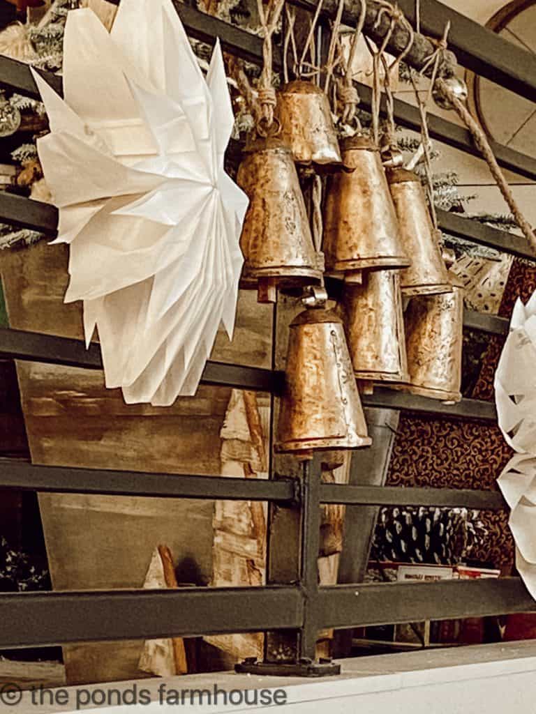 Brass Bell Art is attached to banister for a Rustic Farmhouse Garland.  Industrial Railing in Farmhouse