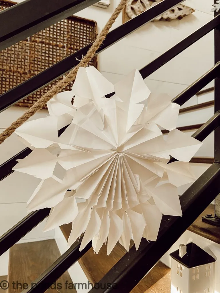 White Paper Bag Snow Flake tutorial for banister garland at Christmas in farmhouse.