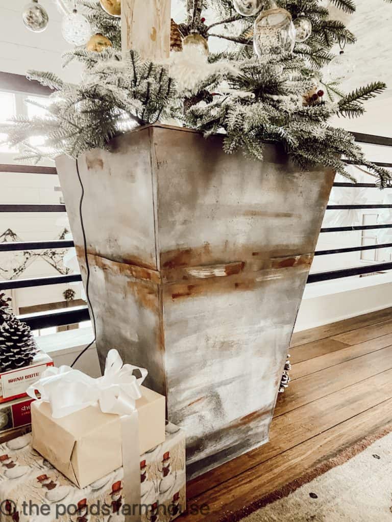 Christmas plants in faux metal planter.