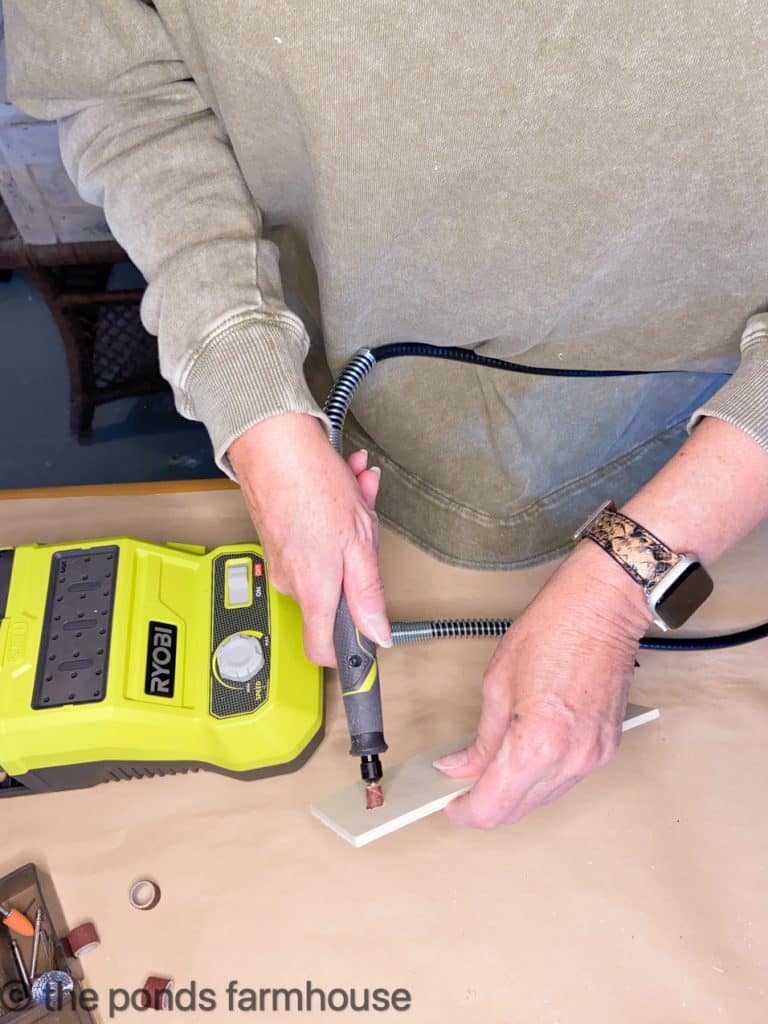 Smooth holes drilled in wooden boards with rotary tool.  