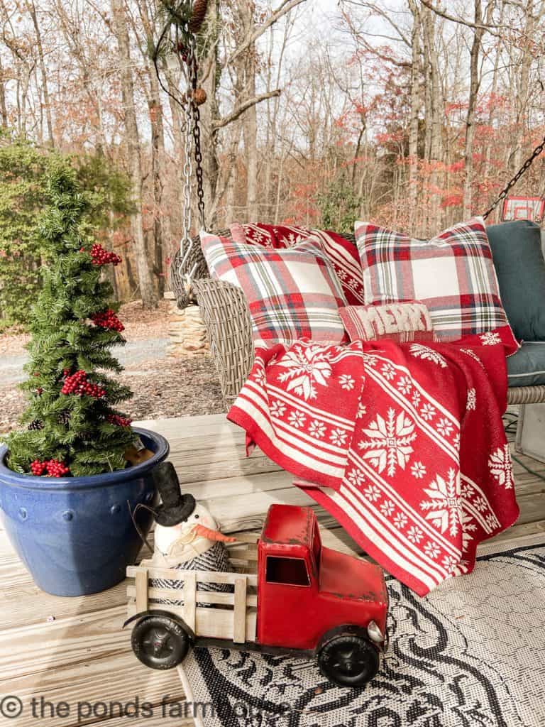 Fun vintage inspired Christmas Decorations enhance the Farmhouse Front Porch vibe.