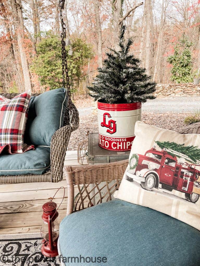 Vintage reds and blues decorate the Farmhouse Outdoor seating area.