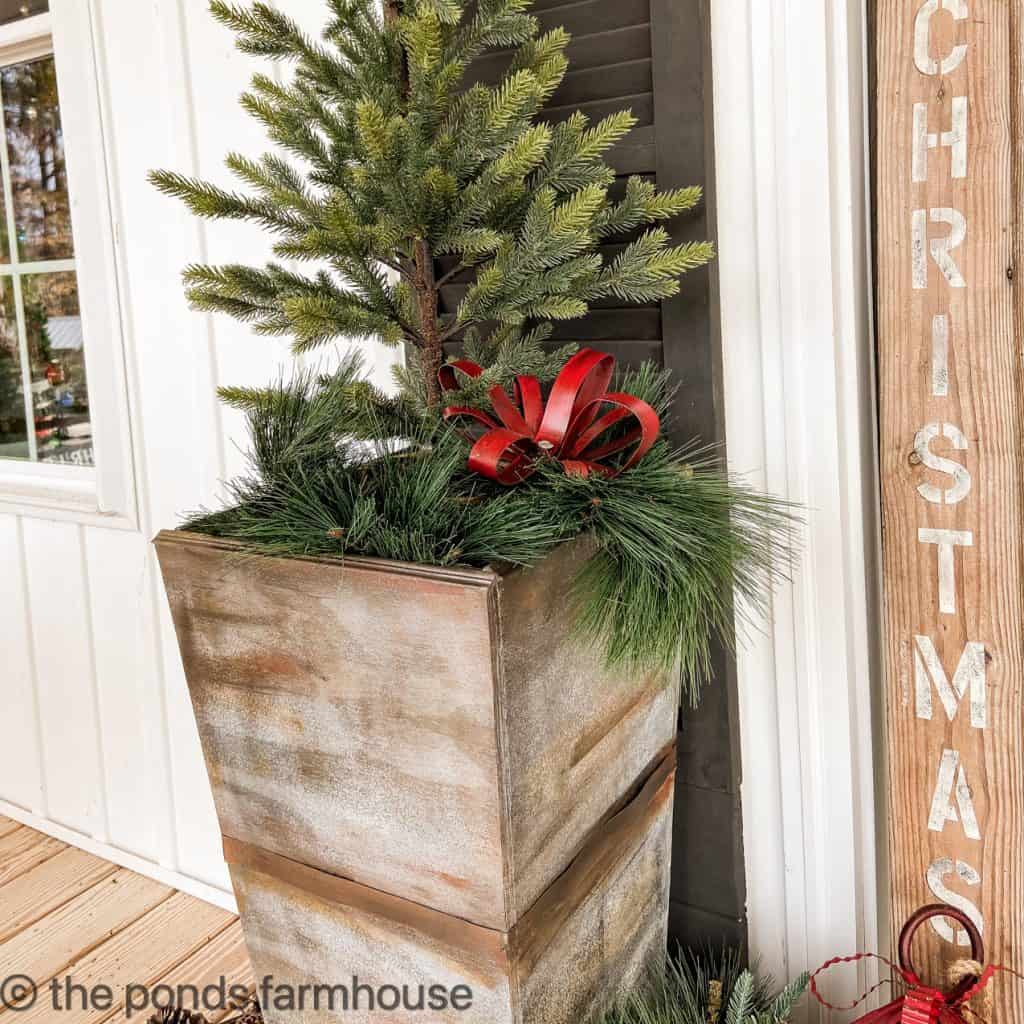 DIY planters filled with simple bare trees.