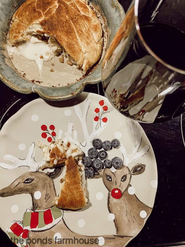 Blueberry, pecan, pancake bread pudding with blueberries on reindeer plates.