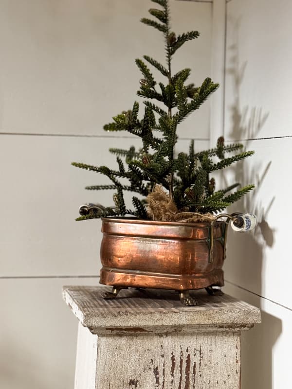 Antique Copper Container with mini Christmas Tree on architectural column