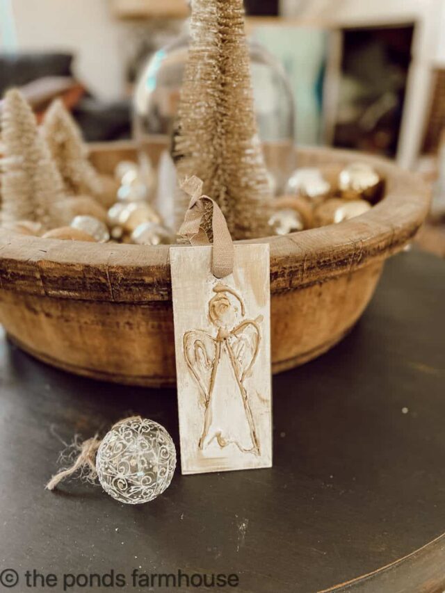 DIY Christmas Ornament made with hot glue gun. Wooden bowl with Christmas ball and bottle brush Christmas trees.