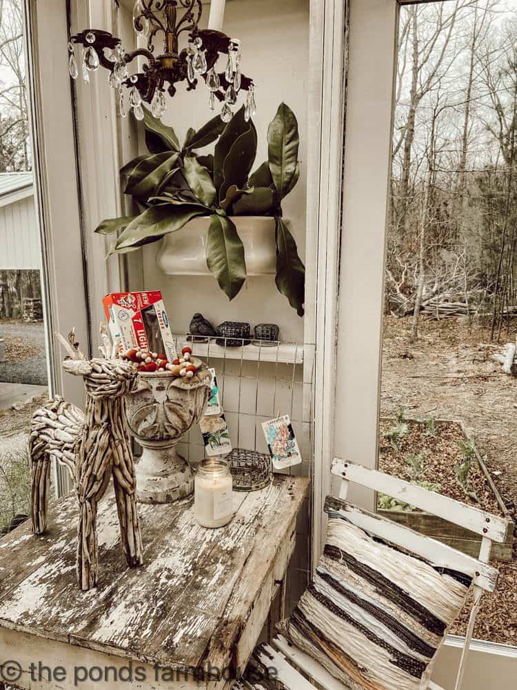 Greenhouse desk with ironstone planter filled with real magnolia leaves