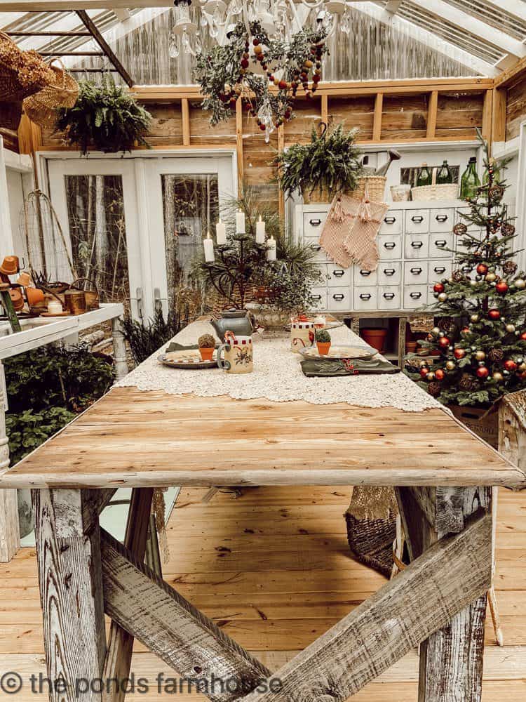 Table set for two and Christmas Tree and apothecary cabinet with DIY Ticking Stockings.
