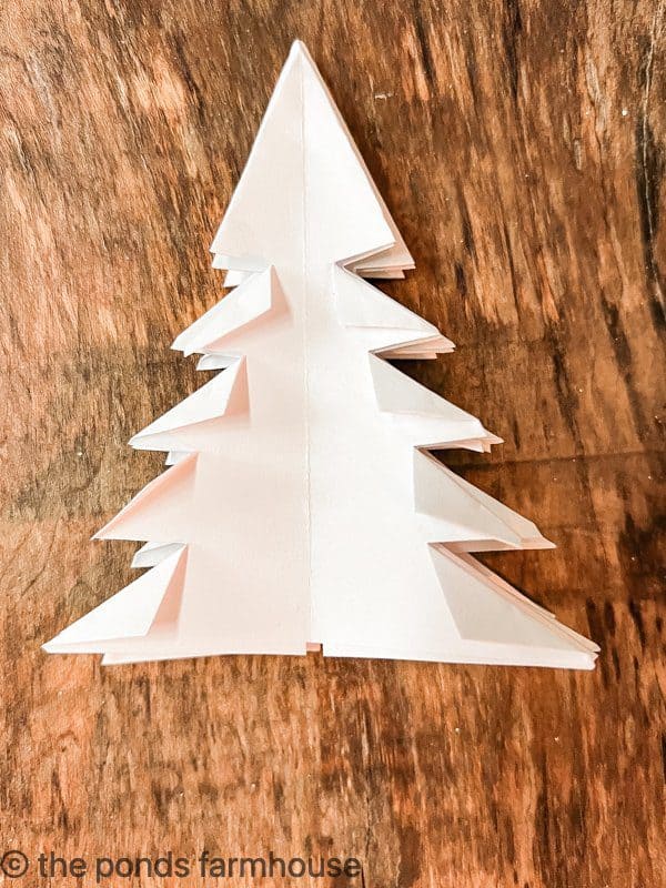 Paper Christmas Tree folded after cuts.