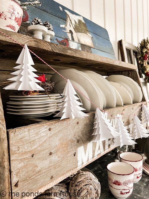 DIY Paper Christmas Trees made into a garland for farmhouse style Christmas Decor.