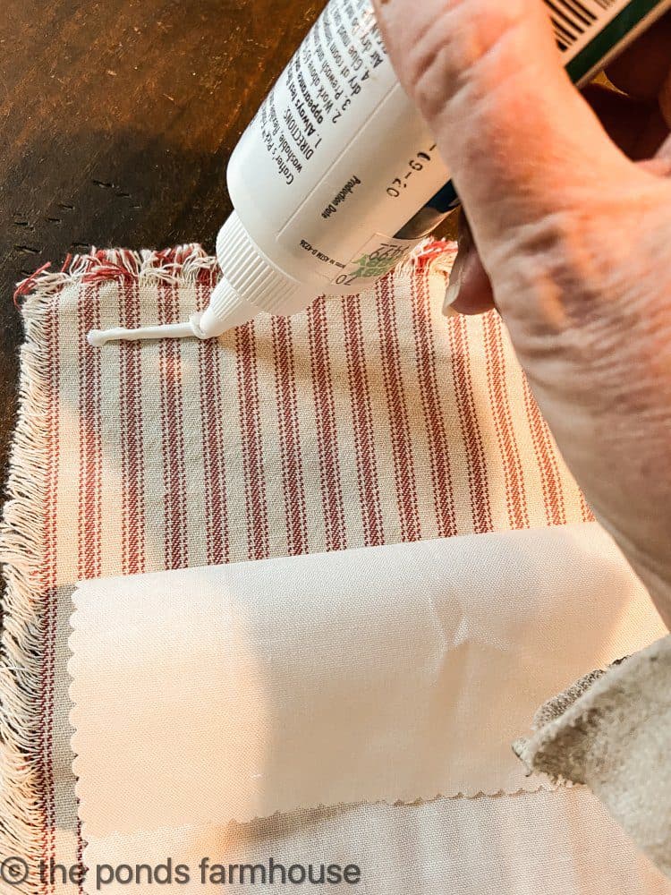 Use fabric glue to attach stocking pieces together.
