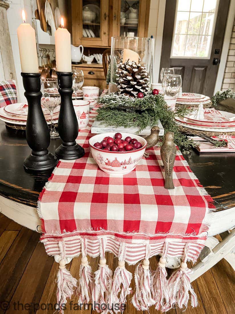 DIY red and white buffalo print and ticking fabric table runner with DIY ticking tassels.  Christmas Tablescape