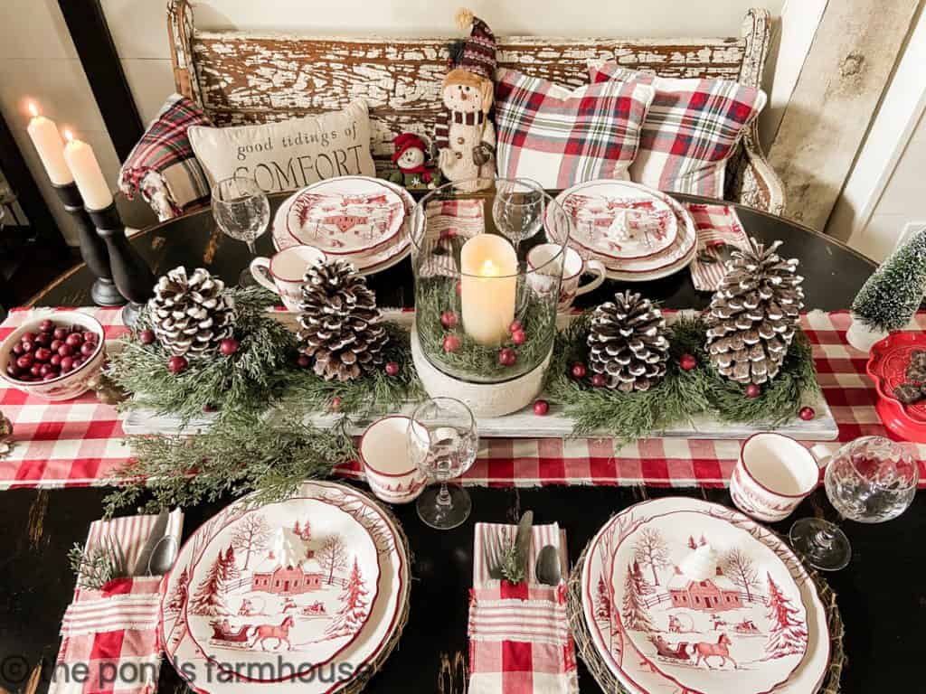 Hurricane candle holder on Christmas Table Centerpiece with plaids and pinecones. Vintage Candlesticks Holder Ideas