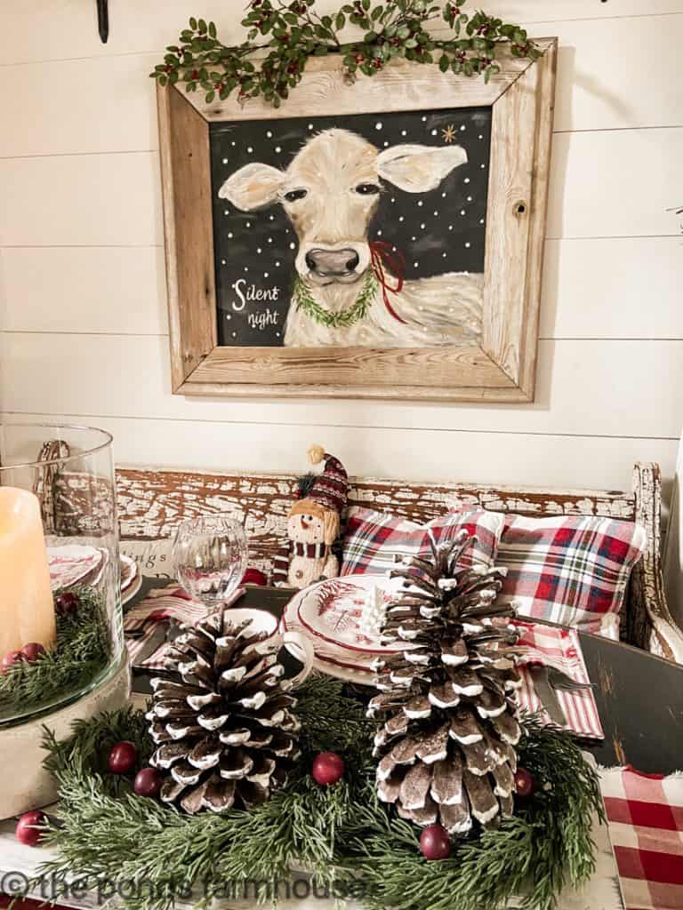 Pinecones and faux cranberries on DIY Table Riser for a festive Christmas Table Centerpiece