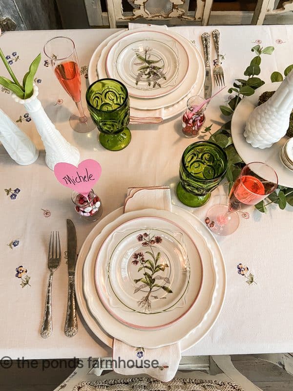 Vintage dishes and second-hand tablecloth for a Galentines Tablescape