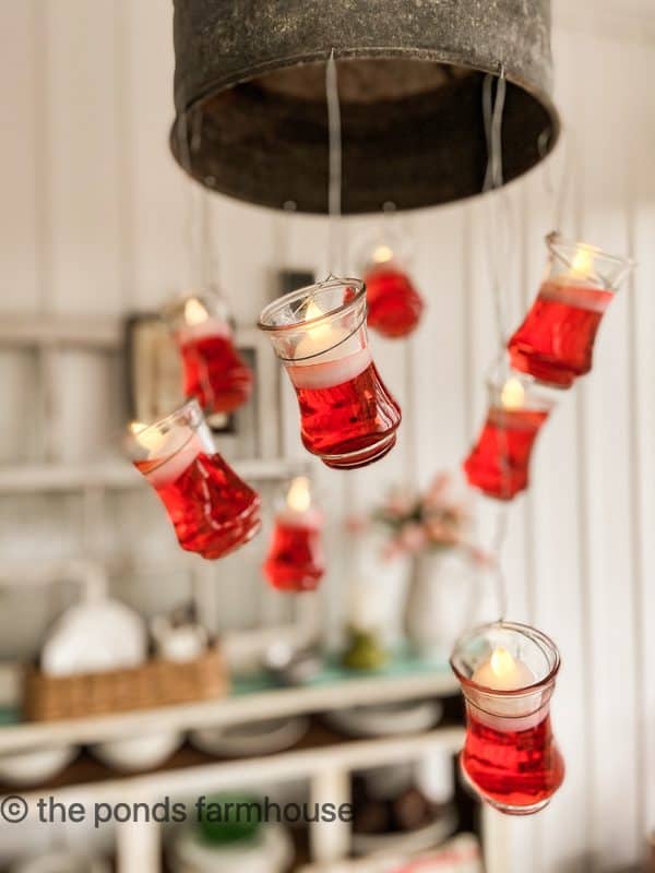 Floating Candles on light fixture above Galentine's Brunch Table.
