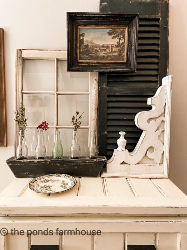 Architectural Salvage Decorating ideas with old shutter, corbel and reclaimed window.  