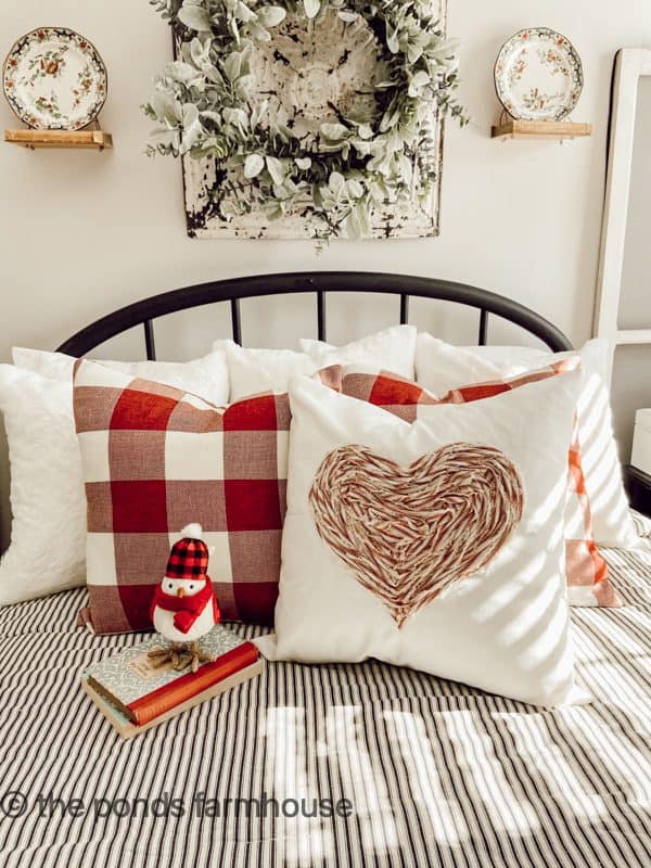 Make custom pillow covers by upcycling fabric scraps for a no-sew unique heart pillow with ticking fabric.