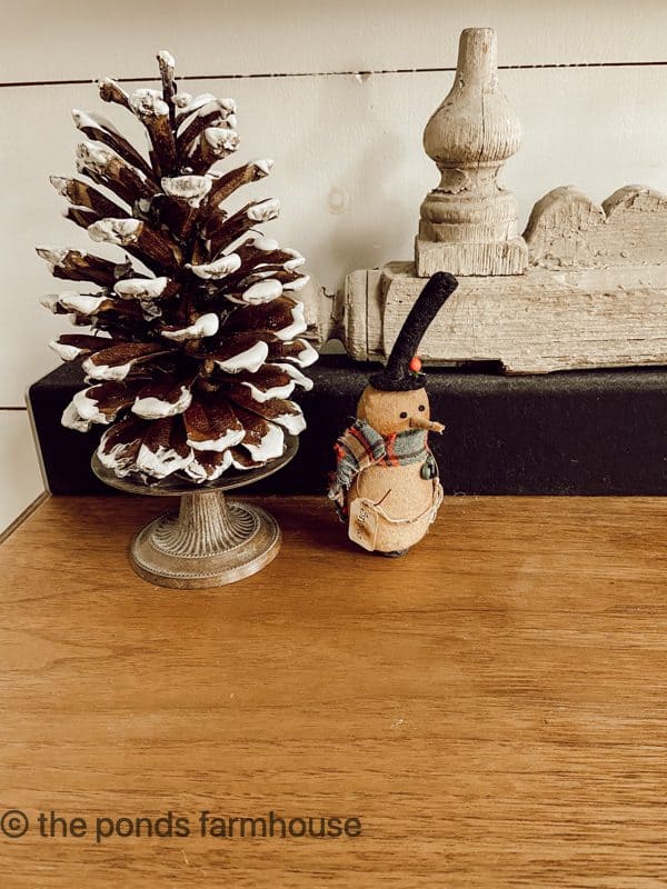 Snow tipped pinecone with small snowman for Decorations for Winter