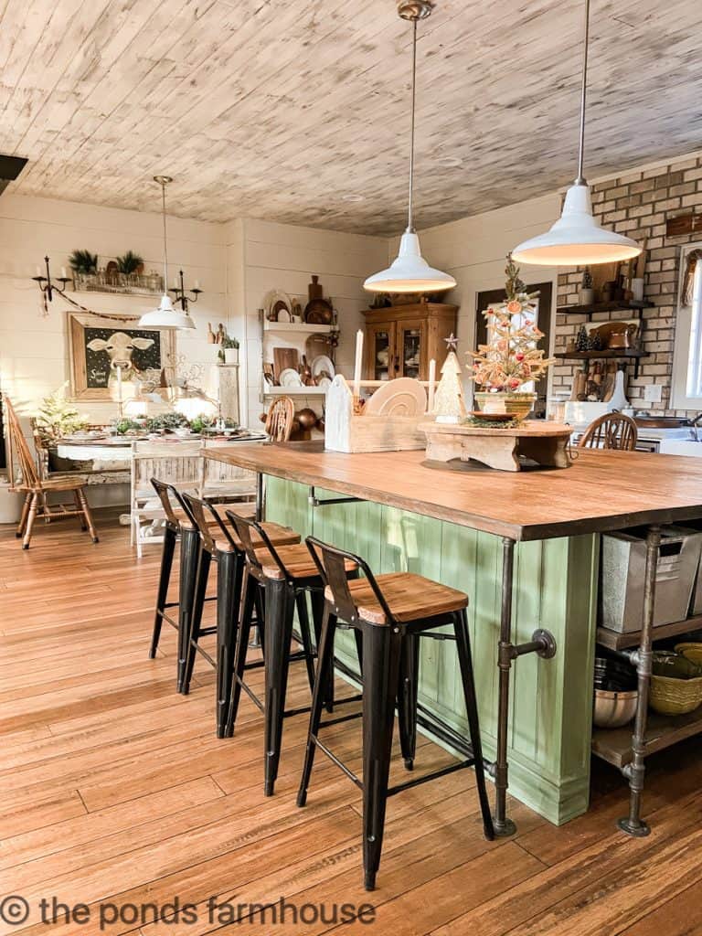 DIY Green Kitchen Island with Industrial Bar Stools and Vintage Enamelware light fixtures
