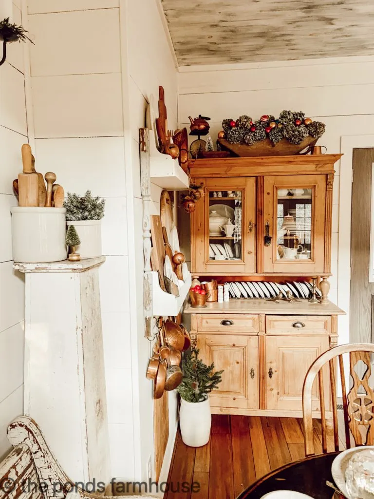 Vintage Charm with crocks filled with Christmas trees and wooden spoons for a modern farmhouse.  