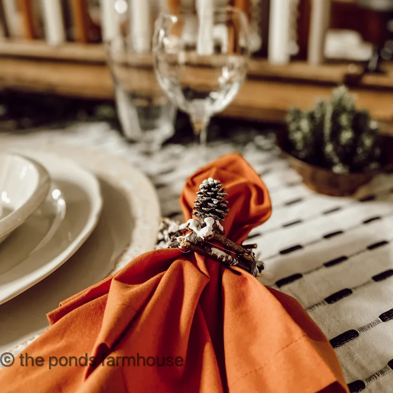 DIY Twig napkin rings add a touch of winter snow to the tablescape