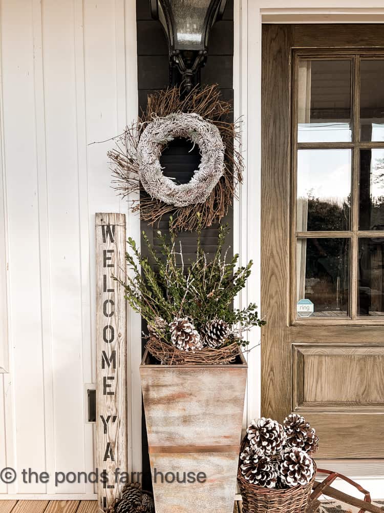 Add boxwood and foraged pinecones for a Winter Planter ideas for January Porch Decorating.  