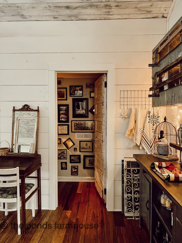 A Gallery Wall as warmth to the loft powder room.