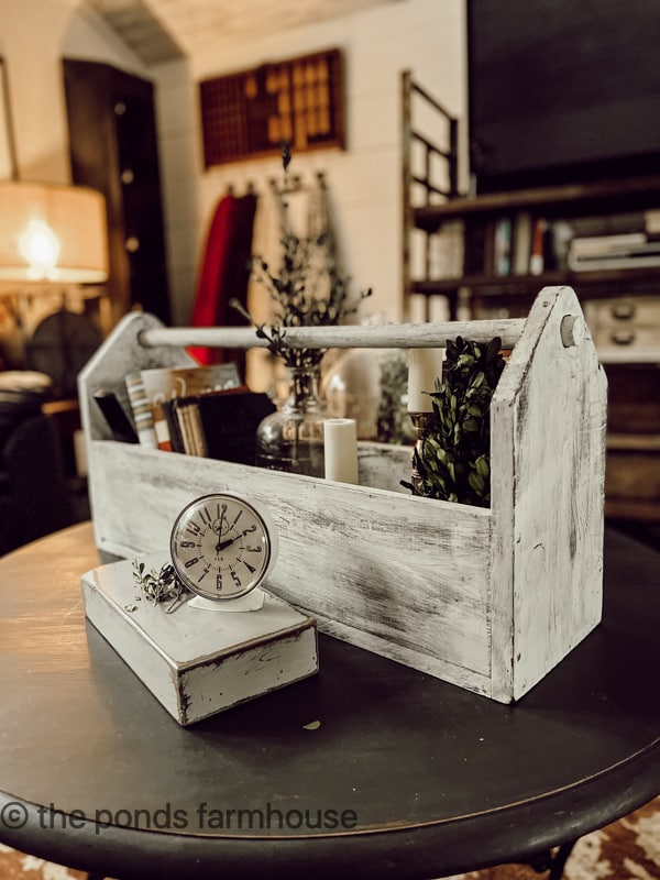 Old Wooden Tool box serves as a centerpiece on the coffee table in the Industrial Loft