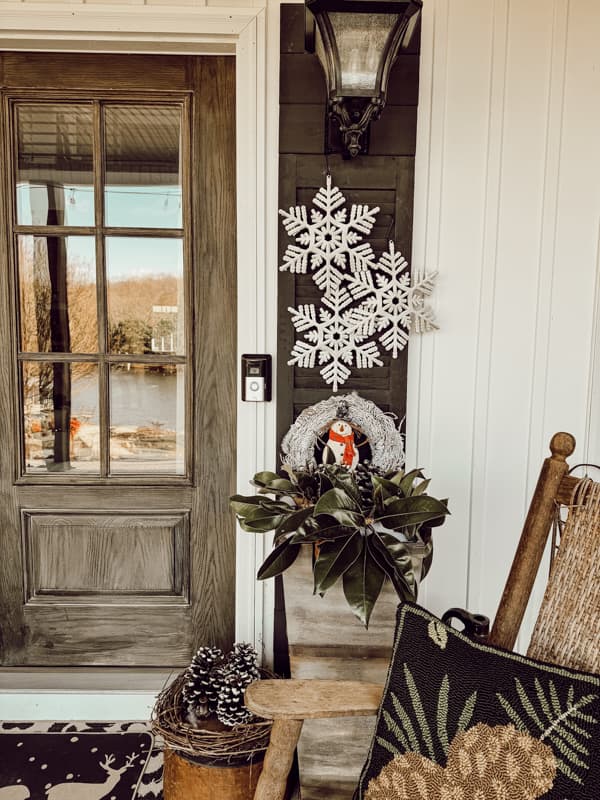 Dollar Tree Snowflakes and snowy wreath in Front Porch Planter for Winter