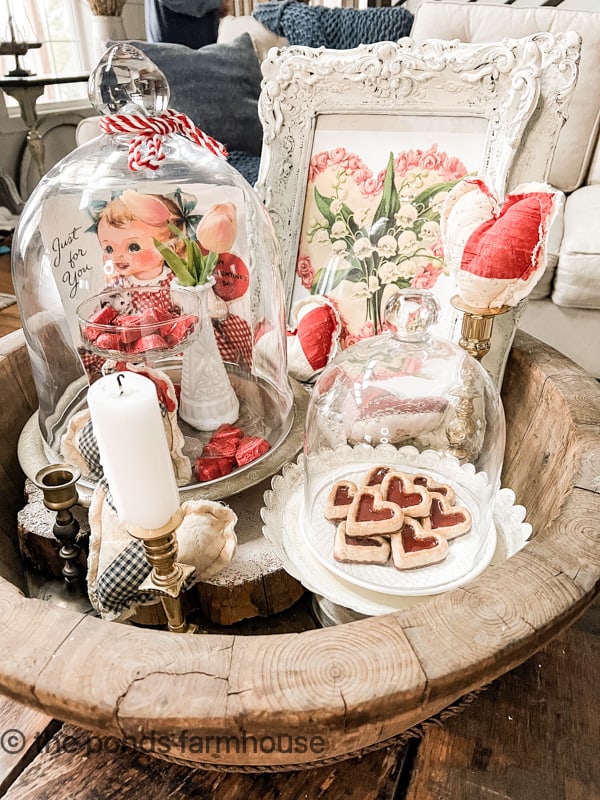 Antique wooden bowl filled with Cloches for Valentines Day Decorating.  Cloche Valentine Decor 