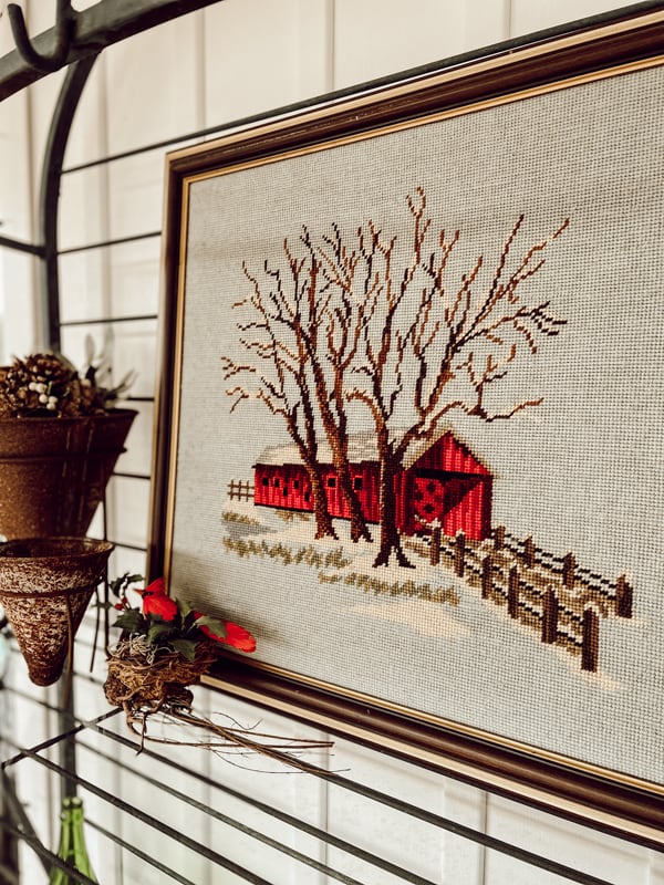 Bring the cottagecore aesthetic into your home this year by thrifting for handcrafted needle work art.  