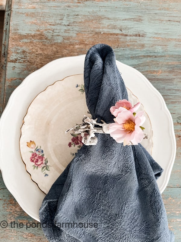 Add silk flowers to twig napkin rings for a spring table setting.