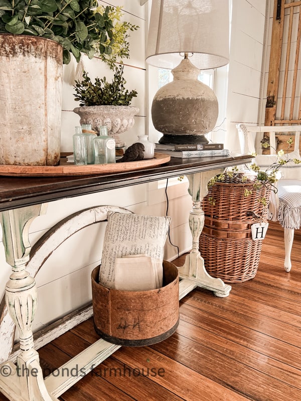 Textures are key with a neutral entry table.  Baskets, greenery, thrift store lamp DIY project and more.