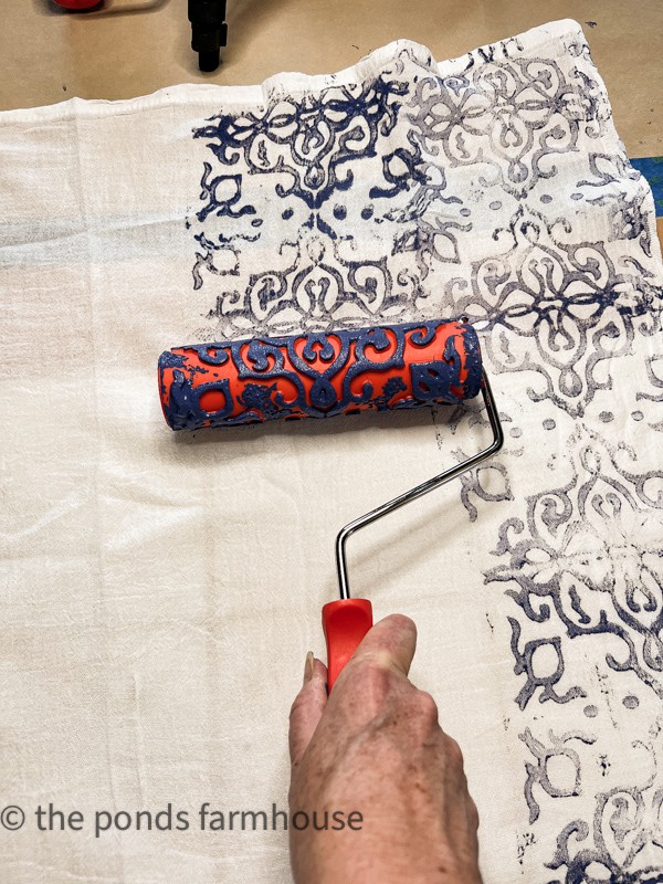 Roll the paint roller to make DIY hand painted flour sack napkins