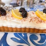 Frozen Limoncello Tart with toasted coconut, lemons, and blackberries.