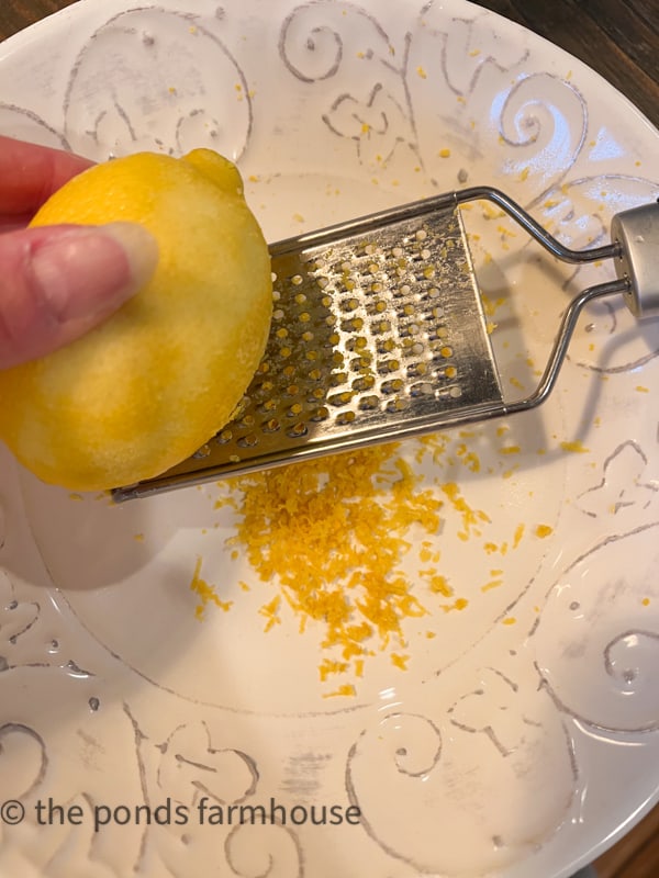 Grate lemon zest for limoncello recipe