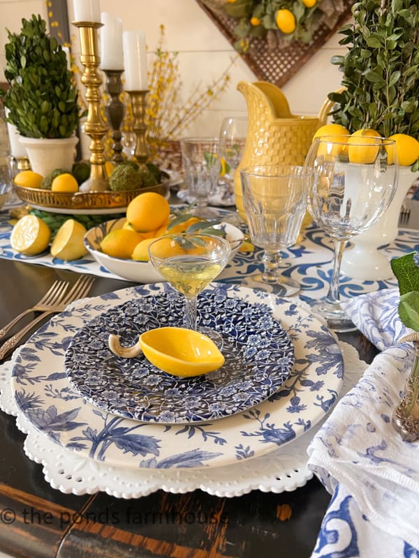 Italian Dinner Party Theme with blue and white dishes, lemon accessories and thrift store tableware.