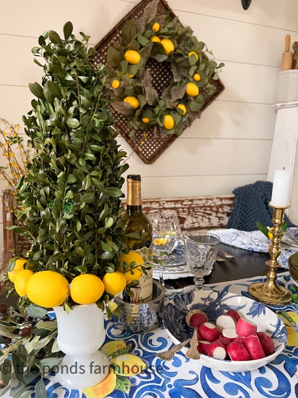 DIY Boxwood  & Lemon Topiaries for Italian Table. Repurposed magnolia wreath with lemons