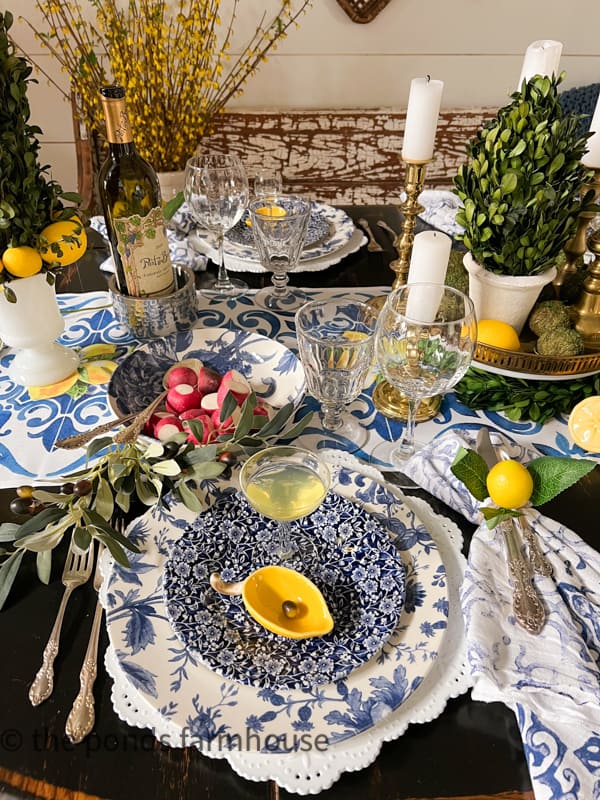 Dinner Table with Italian theme with lemon accessories and flour sack hand painted napkins with lemon napkin rings